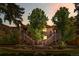 Exterior view of a townhouse complex at dusk, showing well-maintained landscaping at 9587 W 89Th Cir, Broomfield, CO 80021