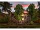 Inviting exterior showcasing wood siding, well-kept landscaping, and charming entrances in warm lighting at 9587 W 89Th Cir, Broomfield, CO 80021