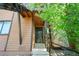 Charming front entrance with decorative door and stone details, accented by greenery at 9587 W 89Th Cir, Broomfield, CO 80021
