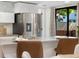 Kitchen and eat in dining area with modern countertops and stainless steel appliances at 9587 W 89Th Cir, Broomfield, CO 80021