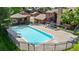 Community swimming pool with clear water, surrounded by fencing and lounge seating for residents' enjoyment at 9587 W 89Th Cir, Broomfield, CO 80021