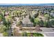 Scenic aerial view of a residential neighborhood with tree-lined streets and mountain views in the distance at 1 Silver Fox Dr, Greenwood Village, CO 80121