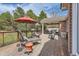 Inviting deck with covered seating and outdoor lounge chairs, perfect for relaxing and entertaining at 1 Silver Fox Dr, Greenwood Village, CO 80121