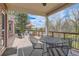Outdoor deck area with seating, wood railing and views of the landscape at 1 Silver Fox Dr, Greenwood Village, CO 80121