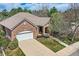 Beautiful brick home with a tile roof, well-manicured lawn, and attached two-car garage at 1 Silver Fox Dr, Greenwood Village, CO 80121