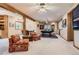 Large game room with pool table, cozy seating, and light carpet at 1 Silver Fox Dr, Greenwood Village, CO 80121