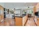 Bright kitchen with a large center island, granite countertops, and an open layout to the living spaces at 1 Silver Fox Dr, Greenwood Village, CO 80121