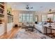 Bright living room with hardwood floors, custom built-ins, and a comfortable sectional sofa at 1 Silver Fox Dr, Greenwood Village, CO 80121