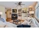 Inviting living room featuring a fireplace, custom built-ins, and comfortable seating arrangements at 1 Silver Fox Dr, Greenwood Village, CO 80121