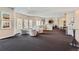 Spacious community lounge featuring cozy seating, a fireplace, and a view of the surrounding landscape at 1 Silver Fox Dr, Greenwood Village, CO 80121