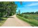 Scenic dirt path through a verdant, tree-lined landscape, offering a peaceful retreat into nature at 1 Silver Fox Dr, Greenwood Village, CO 80121