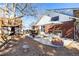 Backyard oasis with a spacious patio, outdoor seating, and a charming fire pit at 13000 Willow Ln, Golden, CO 80401