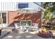 Inviting backyard patio featuring a fire pit and comfortable seating area with an umbrella for shade at 13000 Willow Ln, Golden, CO 80401