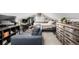 A bonus room is set up with a bed, desk, and sofa at 13000 Willow Ln, Golden, CO 80401