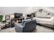 A bonus room is set up with a bed, desk, and sofa at 13000 Willow Ln, Golden, CO 80401