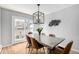Dining room features a large wooden table, seating for six, and access to the outdoor patio at 13000 Willow Ln, Golden, CO 80401