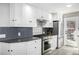 Bright kitchen features stainless appliances, stylish backsplash, and ample cabinet space at 13000 Willow Ln, Golden, CO 80401
