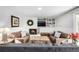 Cozy basement living room with a fireplace, comfortable seating, and built-in shelving at 13000 Willow Ln, Golden, CO 80401