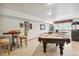 Basement with a pool table, seating area, and picturesque window view at 19595 E Top O The Moor Dr, Monument, CO 80132