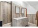Stylish bathroom featuring a double vanity, modern fixtures, and a walk-in shower at 19595 E Top O The Moor Dr, Monument, CO 80132