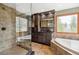 Beautiful bathroom featuring tile flooring, large vanity with granite countertop, soaking tub and walk in shower at 19595 E Top O The Moor Dr, Monument, CO 80132