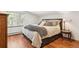 Cozy bedroom with plush bedding and side table for decor and comfort at 19595 E Top O The Moor Dr, Monument, CO 80132