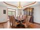 Elegant dining room with hardwood floors, a chandelier, and a large window with views at 19595 E Top O The Moor Dr, Monument, CO 80132