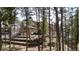 Exterior of a home on a terraced, wooded lot at 19595 E Top O The Moor Dr, Monument, CO 80132