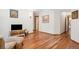 Bright Living Room with hardwood floors and view to additional rooms in the house at 19595 E Top O The Moor Dr, Monument, CO 80132