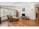 Cozy living room with hardwood floors, natural light, and a comfortable seating area at 19595 E Top O The Moor Dr, Monument, CO 80132
