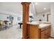 Wet bar with countertop space and seating near a game room featuring a pool table at 19595 E Top O The Moor Dr, Monument, CO 80132
