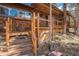 Inviting home entrance showcasing wood stairs and horizontal cable railings at 27407 Upper Cold Spg Gulch Rd, Golden, CO 80401
