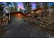 Beautiful home exterior featuring a two-car garage and hillside landscaping at 27407 Upper Cold Spg Gulch Rd, Golden, CO 80401