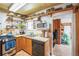Functional kitchen with wood cabinets, modern appliances, and stylish decor at 27407 Upper Cold Spg Gulch Rd, Golden, CO 80401