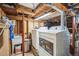 Unfinished laundry room with utility sink and washer and dryer units at 27407 Upper Cold Spg Gulch Rd, Golden, CO 80401