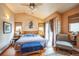 Spacious main bedroom featuring vaulted ceiling, a ceiling fan, and a private patio access at 27407 Upper Cold Spg Gulch Rd, Golden, CO 80401