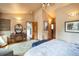 Spacious main bedroom features a vanity area, vaulted ceiling, and great natural light at 27407 Upper Cold Spg Gulch Rd, Golden, CO 80401
