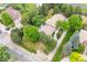 Stunning aerial view of the property, showcasing mature landscaping, driveway, and surrounding neighborhood at 7351 Poppy Way, Arvada, CO 80007