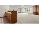 Basement area featuring a wet bar, a view of the backyard, and a wood burning stove at 7351 Poppy Way, Arvada, CO 80007