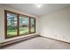 Bedroom with three large windows and tree views at 7351 Poppy Way, Arvada, CO 80007