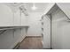 Spacious walk-in closet featuring ample shelving and hanging space for organized storage at 7351 Poppy Way, Arvada, CO 80007