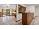 View of the dining area, french doors leading outside, tiled flooring and a built-in wet bar at 7351 Poppy Way, Arvada, CO 80007