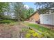 Enchanting backyard featuring a well-maintained garden, lush greenery, and ample space for outdoor enjoyment at 7351 Poppy Way, Arvada, CO 80007