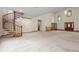 Open living space showcasing a spiral staircase, wood trim, and large front door with sidelights at 7351 Poppy Way, Arvada, CO 80007