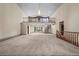 Spacious living room with high ceilings, balcony, spiral staircase, and large windows offering plenty of natural light at 7351 Poppy Way, Arvada, CO 80007