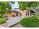 Covered patio with ample seating, offering a perfect spot for outdoor relaxation and entertaining at 7351 Poppy Way, Arvada, CO 80007