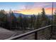 Breathtaking mountain and forest views from this balcony on a serene wooded lot at 5976 Stone Creek Dr, Evergreen, CO 80439