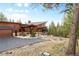 A custom-built home with a three-car garage and beautiful natural surroundings at 5976 Stone Creek Dr, Evergreen, CO 80439
