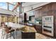 Gourmet kitchen with stainless steel appliances, granite counters, and a breakfast bar at 5976 Stone Creek Dr, Evergreen, CO 80439