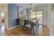 Charming dining area with stylish lighting and a sliding glass door to the backyard at 6020 Quail St, Arvada, CO 80004